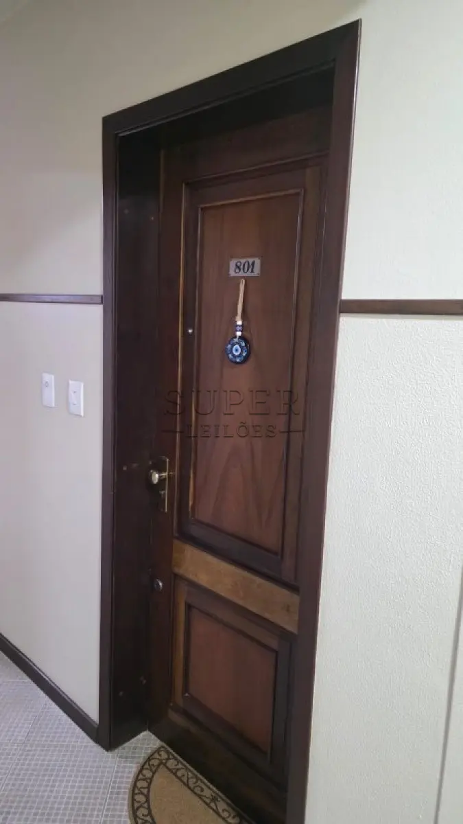 LOTE 002 - Um apartamento nº 801 do Edifício Condomínio Residencial União de Moços, localizado na Rua Sete de Setembro, 744, no município de Cachoeira do Sul - RS