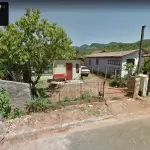 TERRENO  DE 250M², COM DUAS CASAS, UMA DE MATERIAL NECESSITANDO REPAROS E OUTRA DE MADEIRA.(CONFORME AUTO DO OFICIAL DE JUSTIÇA)
